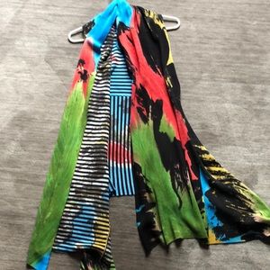 Asymmetrical mid length vest, reversible